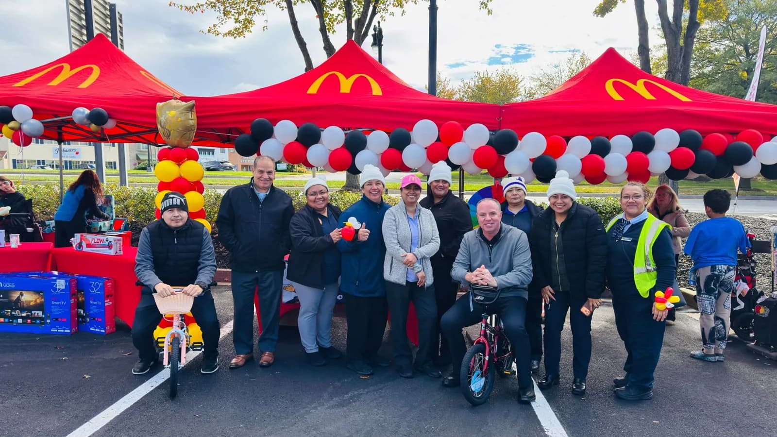 The Urbana crew and leadership team gathered under the McDonald's tents at Community Day