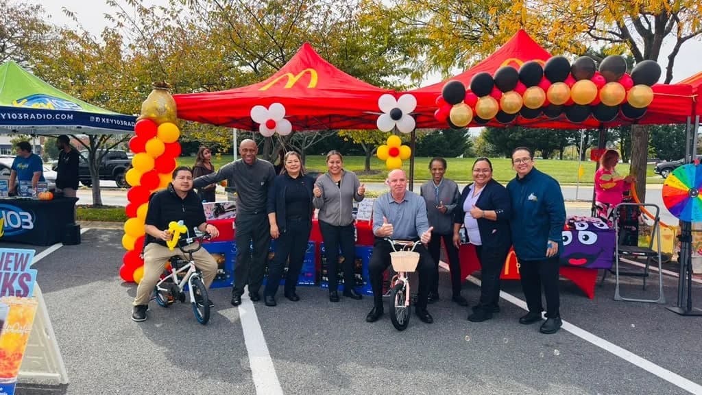 The Westview crew and leadership team together under the McDonald's tents at Community Day